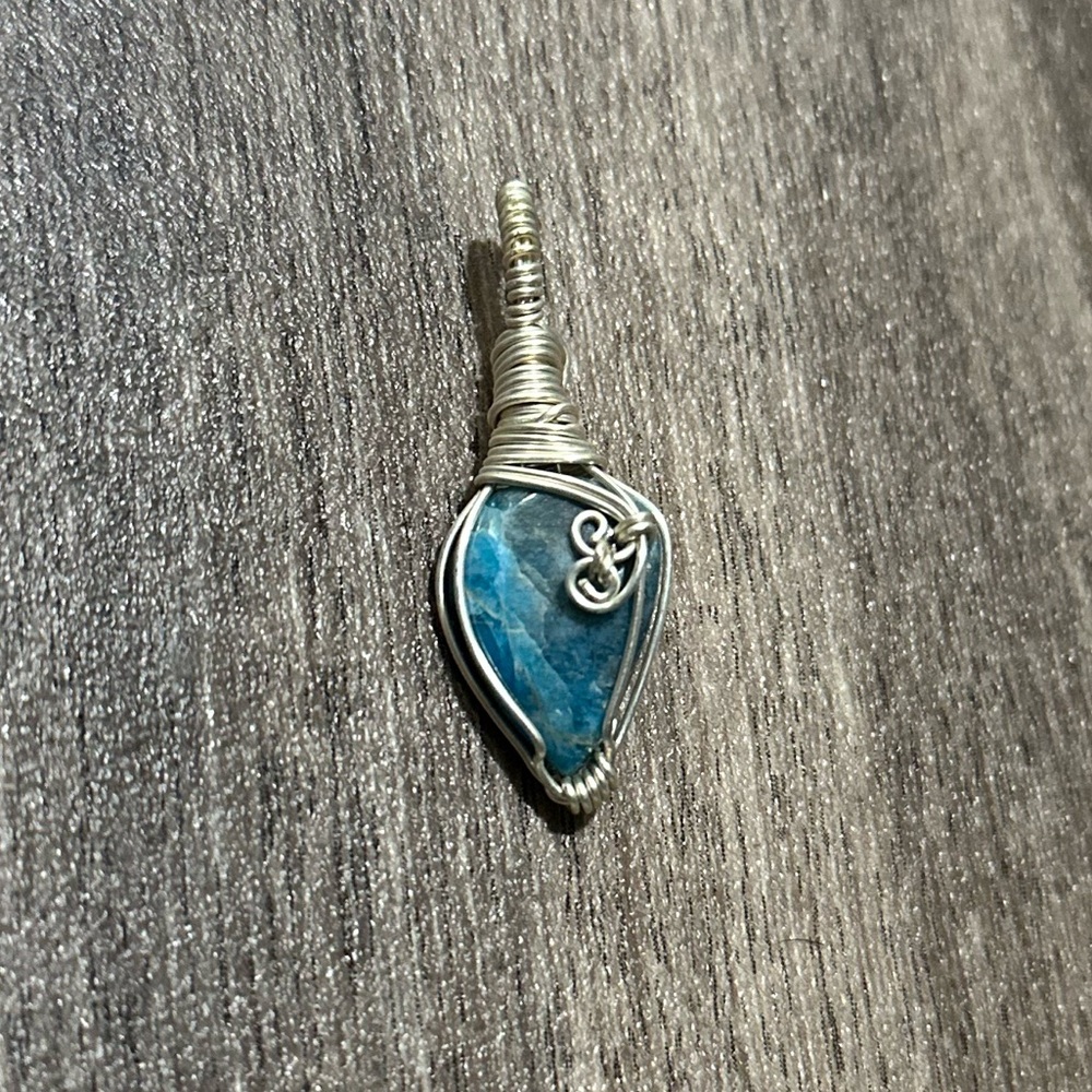 Elegant Blue Apatite wrapped in silver pendant
